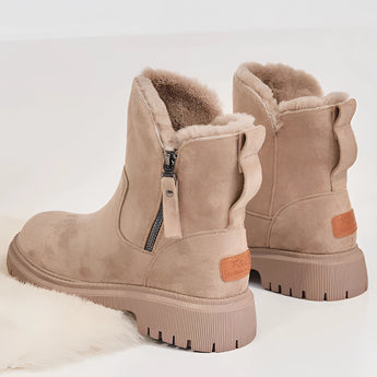 Women's black fur-lined ankle boots with zipper and chunky sole, featuring a stylish design suitable for outdoor wear.
