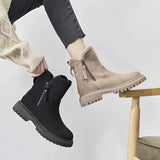 Women's black fur-lined ankle boots with zipper featuring a chunky sole, showcasing a stylish and fashionable design.