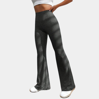 
A pair of women's high-waist flare yoga pants in dark gray, designed for athletic wear. The pants are moisture-wicking, featuring a comfortable waistband that sits at the waist and flares out at the thighs, suitable for sports or casual fashion.