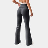 Women's black high-waist flare yoga pants designed for athletic activities, featuring a moisture-wicking fabric. The pants are styled for comfort with a fitted waist and a flared leg, suitable for active wear and exercise.