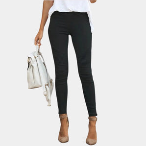 Women's black high-waisted biker jeans made from stretch denim, showcasing a fitted silhouette with unique moto detailing on the legs, in a size 3XL.