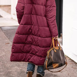 Women's oversized puffer coat in black with a hood, featuring a street style design. The coat is shown in a Bordeaux color variant and is size 3XL. The image highlights details like the coat's sleeves, shoulder fit, and tailored waist, emphasizing its fashionable and urban look.