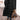 Women's black hooded oversized puffer coat in an urban street style, featuring long sleeves and a spacious fit.