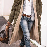 Women's black oversized hooded puffer coat in urban street style, featuring an army green color in 3XL size, shown paired with jeans and a dress shirt.
