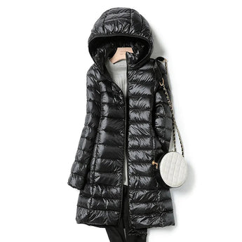 Women's black hooded puffer coat featuring a long quilted design, insulated for warmth. The coat includes a hood, a full-length zipper, and long sleeves.