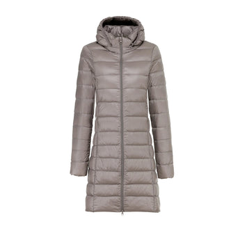 Women's khaki hooded puffer coat in 3XL size, featuring a long quilted design with insulation, a fur-trimmed collar, and pockets.
