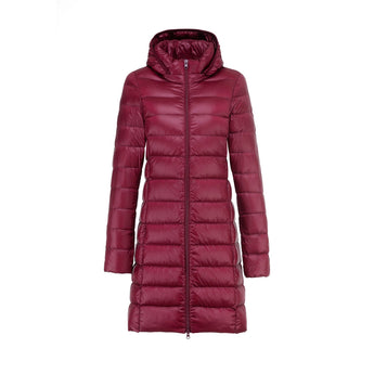 
A women's long quilted insulated jacket in a wine red color, featuring a hood and a puffer design. The coat includes long sleeves and a high collar for added warmth.