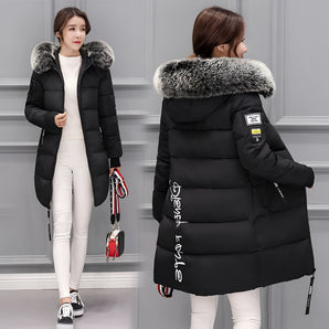 Women's black insulated winter parka with a fur-lined hood, featuring long sleeves and a tailored fit suitable for cold weather. The parka is shown in a 3XL size, emphasizing its stylish and functional design with a focus on warmth and comfort.