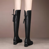 Women's black knee-high leather boots with a tassel and block heel, showcasing stylish and comfortable footwear for fashion-forward individuals.