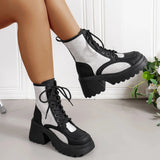 Women's white lace-up combat boots featuring a chunky heel platform design.