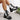 Women's white lace-up combat boots featuring a chunky heel platform design.