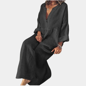 Women's black linen wide-leg jumpsuit featuring a V-neckline and long sleeves in a bohemian style, displayed in size 3XL.