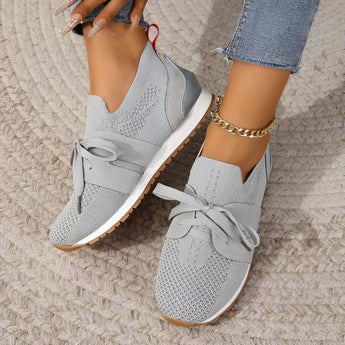 Women's gray breathable running sneakers with mesh material, shown in size 43. The lightweight, slip-on design is fashionable and cool, suitable for walking and running.