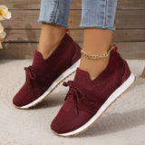 Women's black mesh breathable running sneakers with a lightweight slip-on design, featuring red accents and size 43.