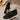 Women's black mesh breathable running sneakers, lightweight slip-on design, displayed against a neutral background, showcasing the synthetic rubber sole and athletic build.