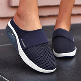 Women's dark blue mesh slip-on sneakers featuring a lightweight and breathable design.