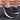 Women's dark blue mesh slip-on sneakers featuring a lightweight and breathable design.