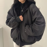 
A women's black oversized bomber jacket in size 2XL, featuring a trendy puffer design ideal for winter. The coat has a prominent collar, long sleeves, and a comfortable waist fit, providing both style and warmth.