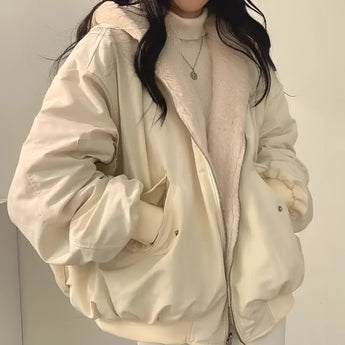 Women's oversized bomber jacket in black, styled as a trendy puffer winter coat. The variant shown is a khaki color in size 2XL, featuring a prominent collar and long sleeves. The design resembles a trench coat with a focus on fashion-forward outerwear.