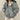 Women's blue oversized bomber jacket in 2XL, featuring a trendy puffer style suitable for winter, with a focus on the outerwear's structured shoulder, neck, sleeve, and collar design.