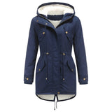 Women's blue parka coat with a faux fur hood, featuring thermal insulation and waterproof materials, designed as outerwear with long sleeves and button closure.