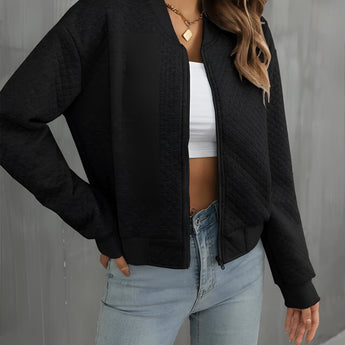 Women's black quilted bomber jacket featuring lightweight material, trendy design, and ideal for fall layering, with a focus on shoulder, collar, and sleeve details.