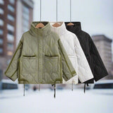 Women's black quilted puffer jacket with a hood, featuring insulated, water-resistant fabric, long sleeves, and a high collar.