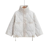 Women's white quilted puffer jacket with hood, featuring long sleeves, insulated and water-resistant material, designed for warmth and comfort.