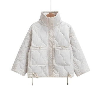 Women's white quilted puffer jacket with hood, featuring long sleeves, insulated and water-resistant material, designed for warmth and comfort.