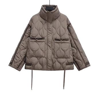 Women's black quilted puffer jacket featuring an insulated, water-resistant design with a hood, long sleeves, and a stylish collar.