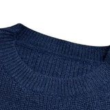 Women's black ribbed color block sweater with white cuffs featuring a cozy knit design, long sleeves, and a stylish pattern suitable for casual wear.