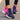 Women's black running sneakers with breathable mesh and cushioned sole featuring pink and blue accents, size 42, shown on a person wearing sportswear.
