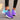 Women's black running sneakers with breathable mesh and cushioned sole, featuring a vibrant blend of blue and purple colors in size 42.