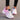 Women's black running sneakers with breathable mesh and cushioned sole, shown in a pink and white colorway, size 42.