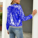 Women's black sequin bomber jacket with shiny glitter, featuring a zip-up front, shown being worn with blue jeans.