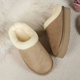 Women's khaki platform loafers with fuzzy shearling lining and a beige exterior, designed for comfort and style.