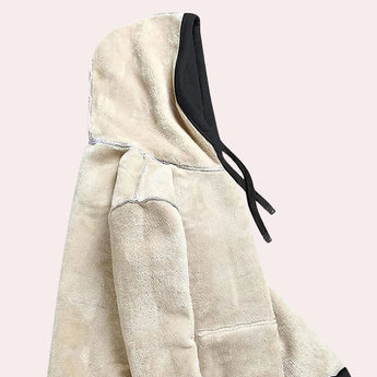 Women's black sherpa lined fleece pullover hoodie displayed on a hanger, showcasing its long sleeves and warm winter design.