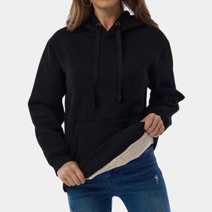 Women's black sherpa-lined fleece pullover hoodie with a warm winter design, featuring long sleeves, a comfortable waist fit, and a cozy collar.