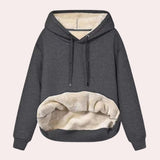 Women's dark gray sherpa lined fleece pullover hoodie in XL size, featuring a cozy, soft interior for warm winter wear. The hoodie has long sleeves and a comfortable collar, designed for both style and warmth.
