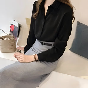 Elegant women's black silk blouse designed for office wear, featuring long sleeves with button cuffs, shown in size 4XL.