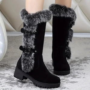 Women's black suede knee-high winter boots with fur trim, featuring a sleek design and sturdy sole, suitable for cold weather.