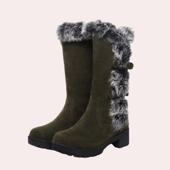 Women's black suede knee-high winter boots featuring a fur trim, designed for cold weather.