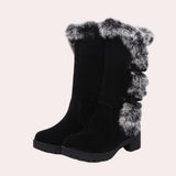 Women's black suede knee-high winter boots with fur trim, featuring woolen material and designed for fashion and warmth.