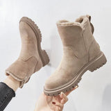 Women's black suede waterproof ankle boots with fur lining, showcasing a stylish and practical winter design.