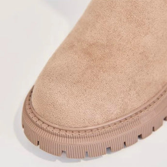 Black suede waterproof winter ankle boots for women featuring a fur-lined interior.