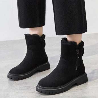 
Women's black suede waterproof fur-lined winter ankle boots in size 42, showcasing a stylish and practical design suitable for cold weather.