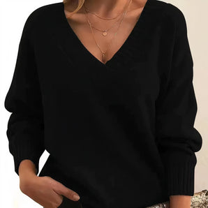 Women's black V-neck cashmere sweater with elegant long sleeves, featuring a soft knit texture, shown in a size 2XL.