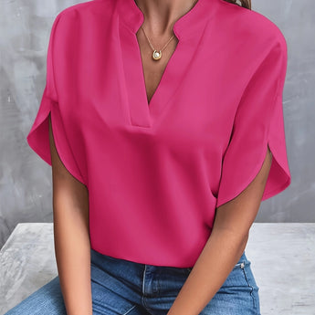 Women's black v-neck blouse with split sleeves, designed for an elegant and professional summer work look.