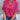 
A woman wearing a pink XXL V-neck split sleeve blouse, styled elegantly for summer work attire.