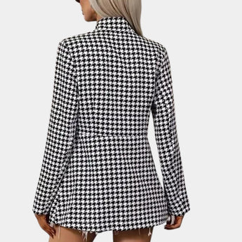 Women's black and white houndstooth blazer, featuring a classic tartan pattern, long sleeves, and a structured shoulder design, ideal for office wear.